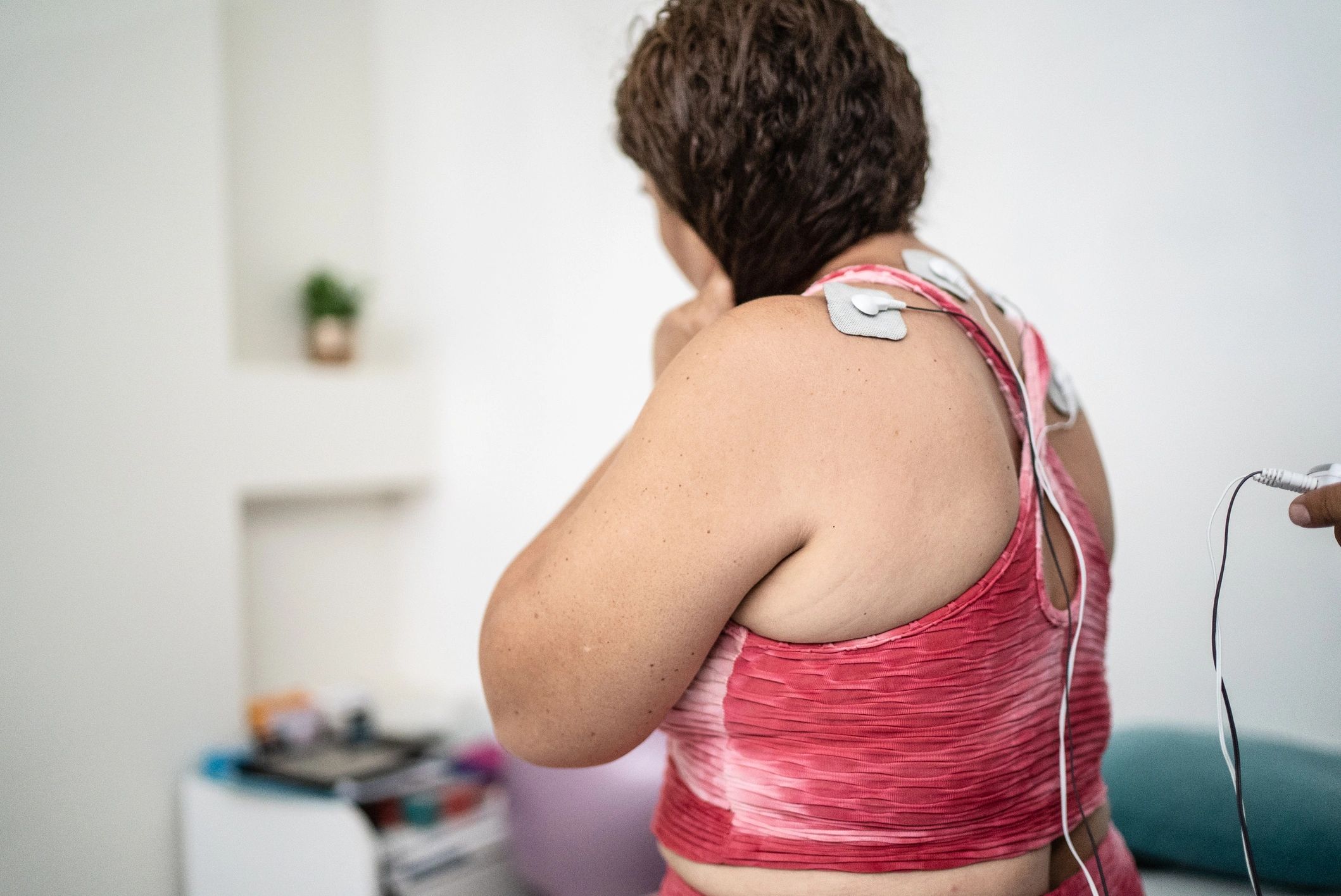 Physical therapy electrostimulation being applied during treatment